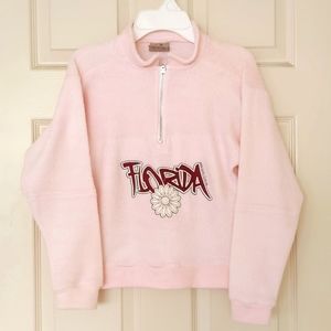 Girl's Fleece half-zip top with design.